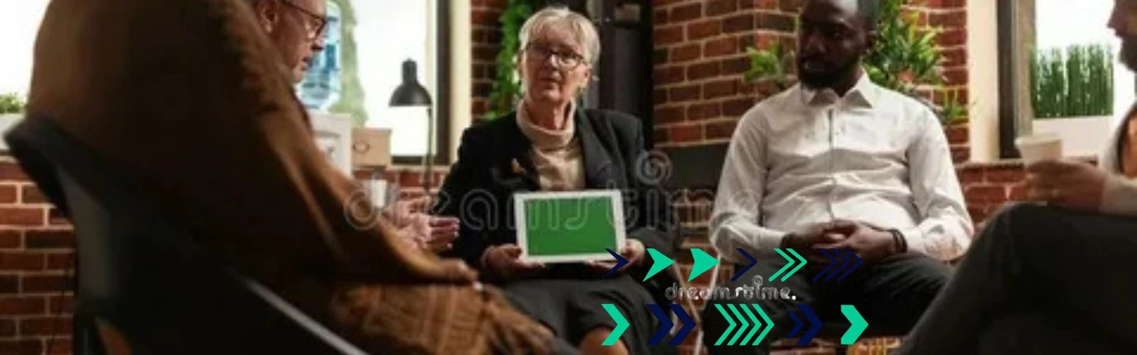 A mental health therapy session with a clinician using a tablet
