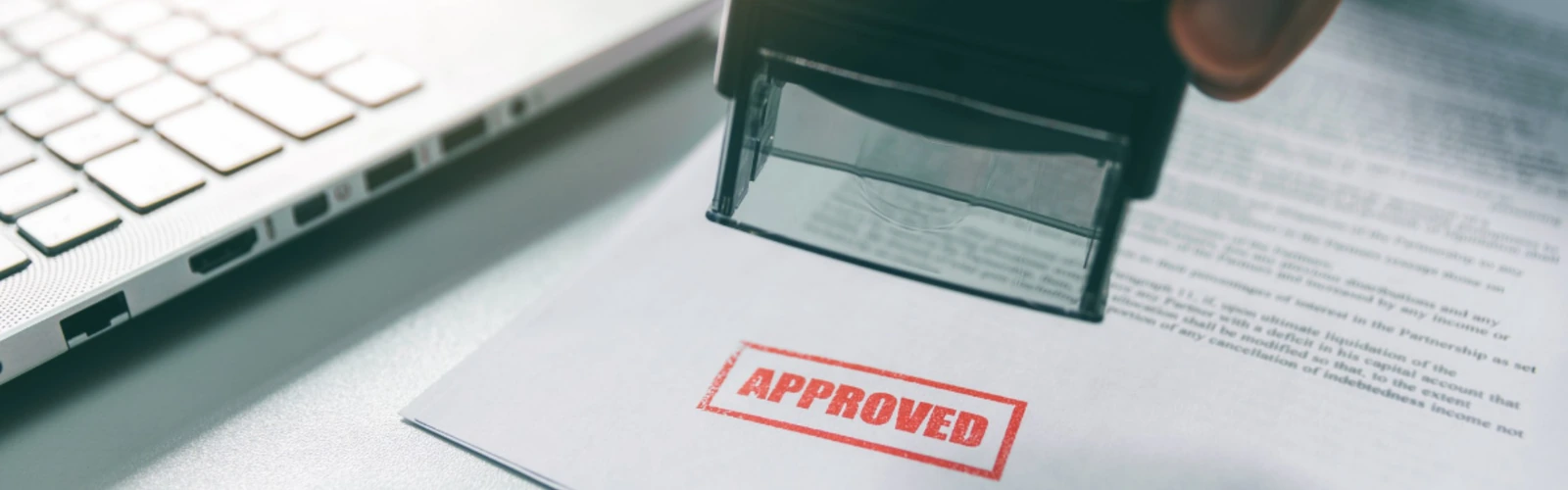 An approved insurance document with performance-gauge overlays
